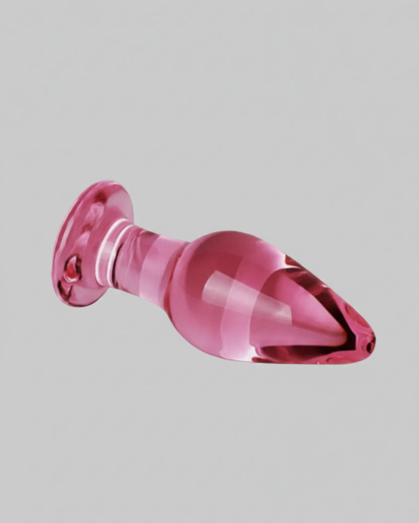 Pink plastic object on a gray background