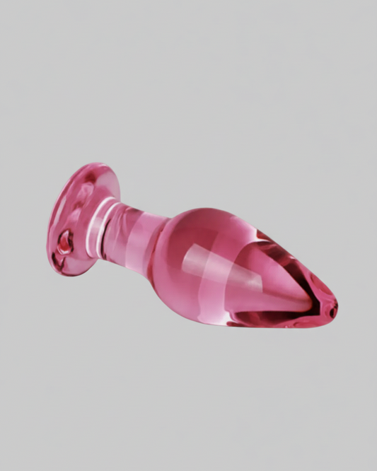 Pink plastic object on a gray background