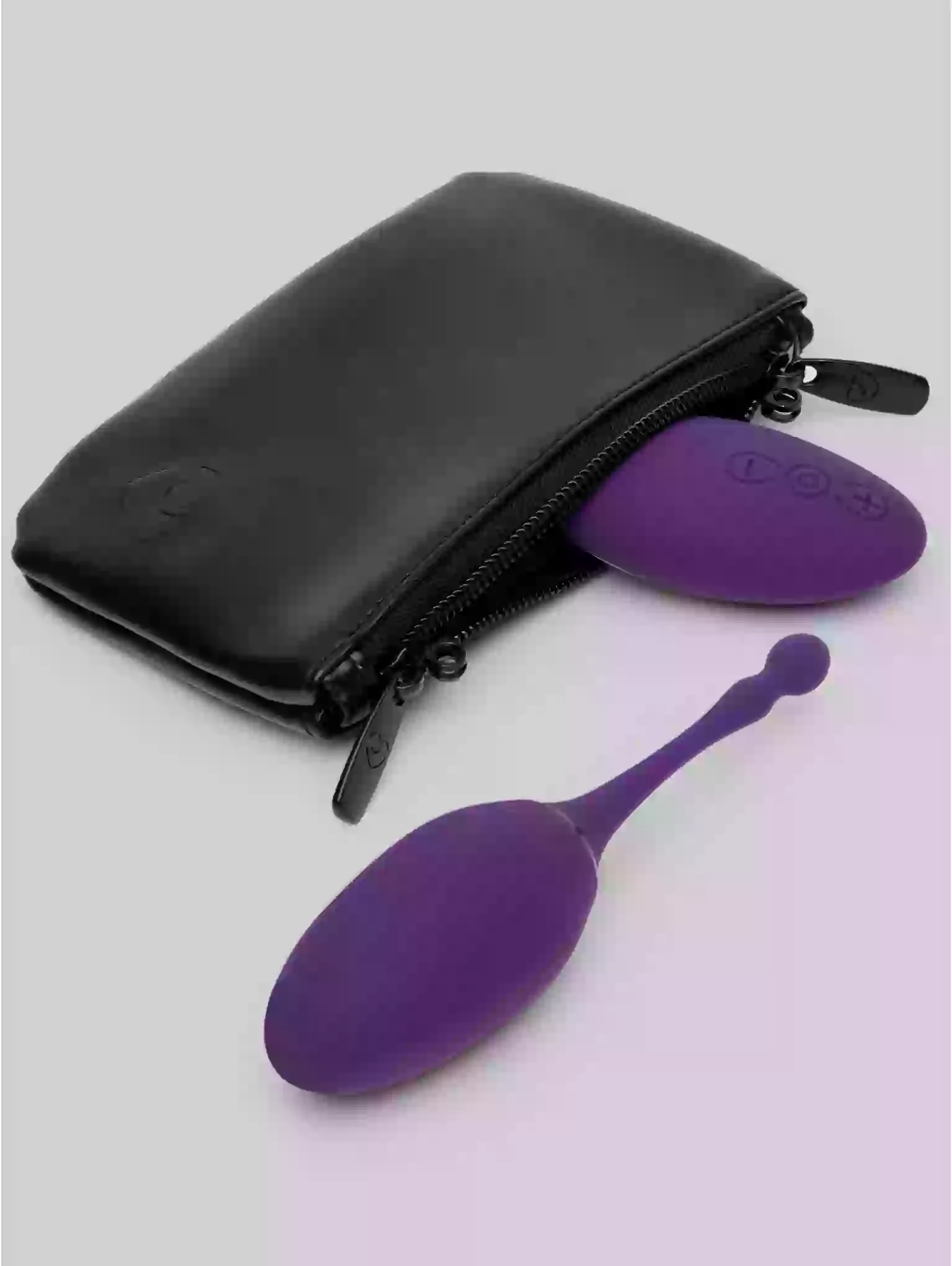 Purple silicone tool with a black case on a light gray background