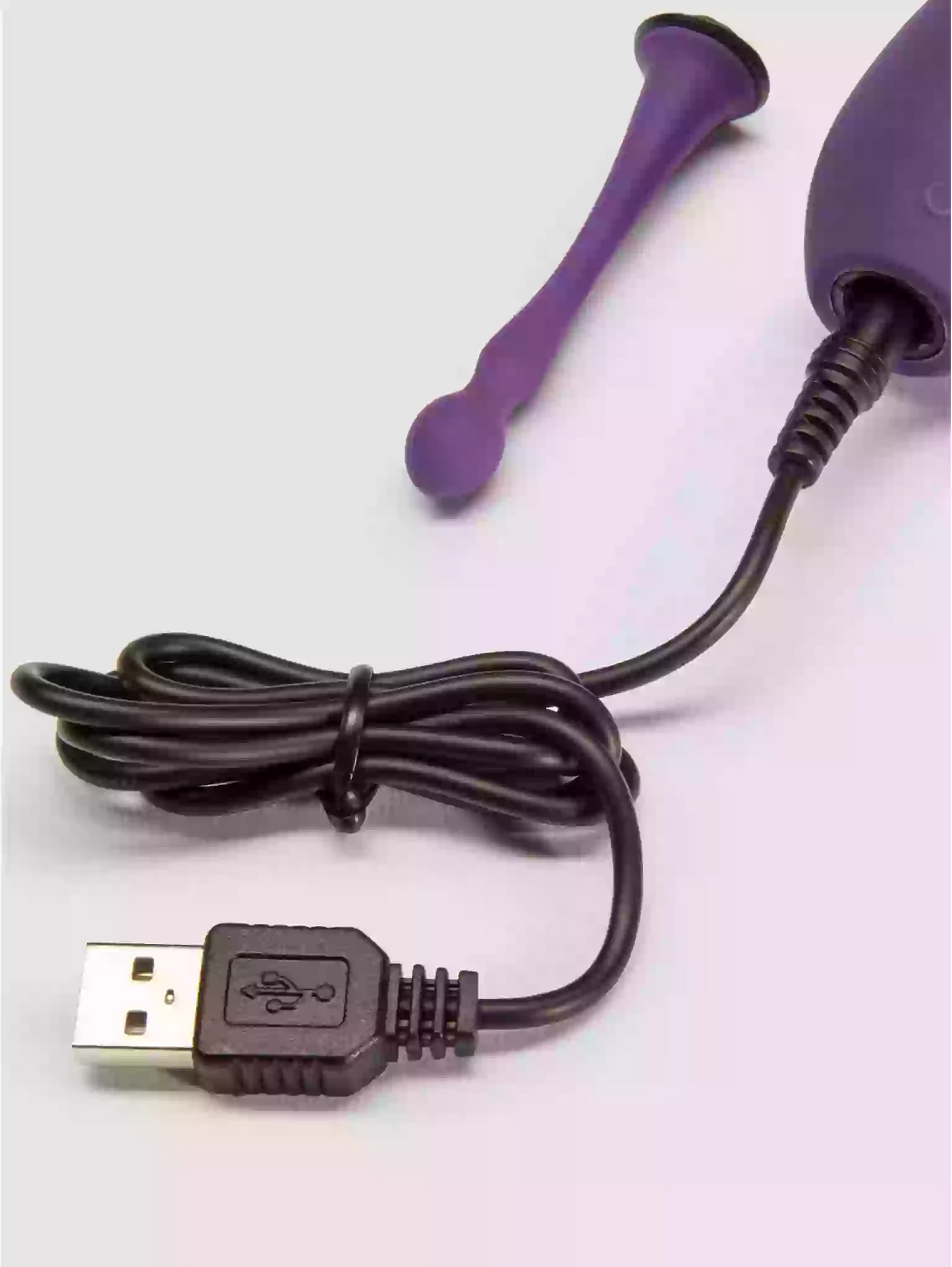 Purple USB device with a cable on a white background