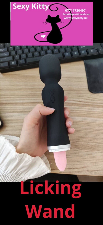 Hand holding a 'Licking Wand' with promotional text and contact information on a desk.