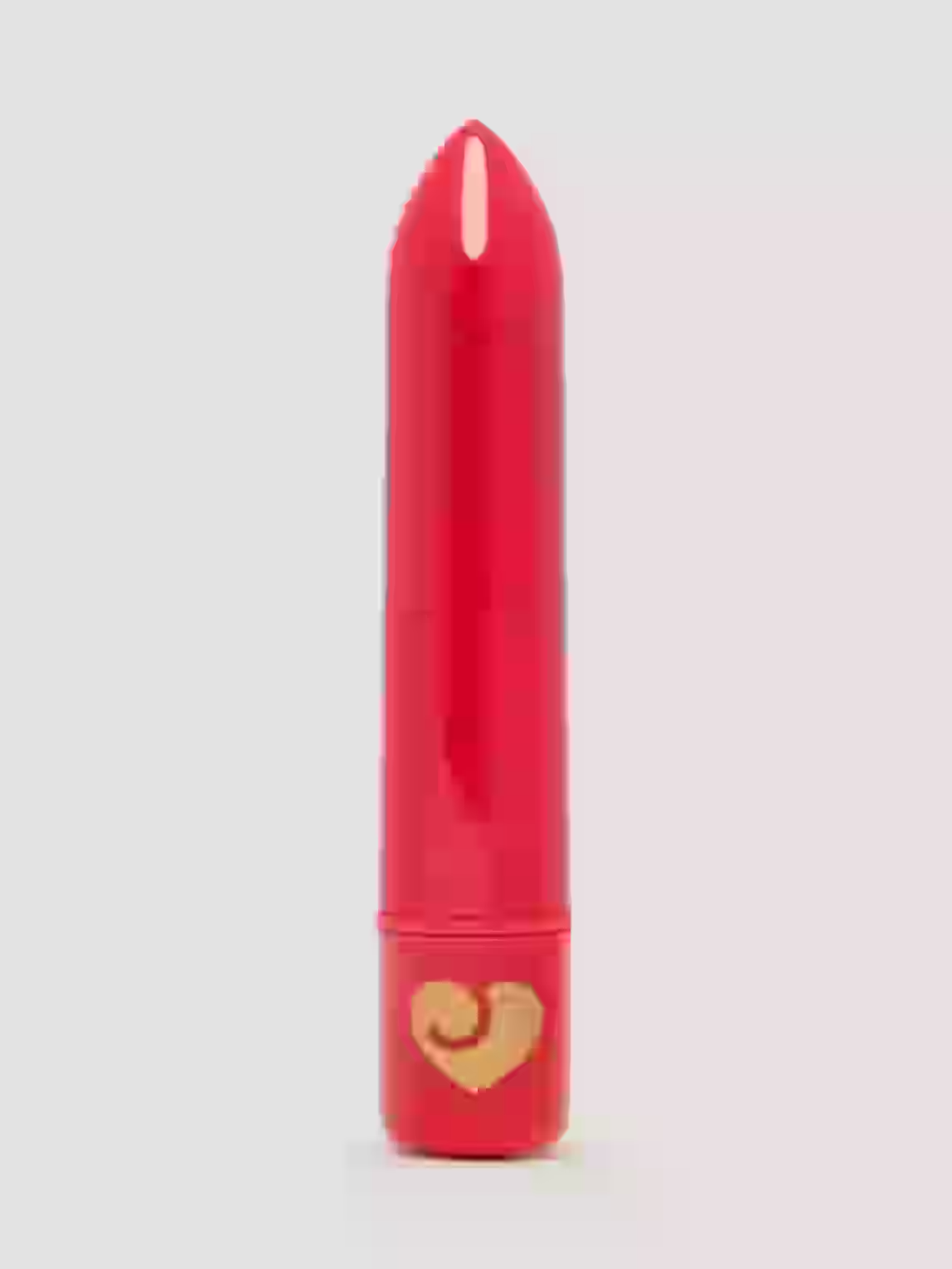 Red lipstick with a gold heart on a light gray background