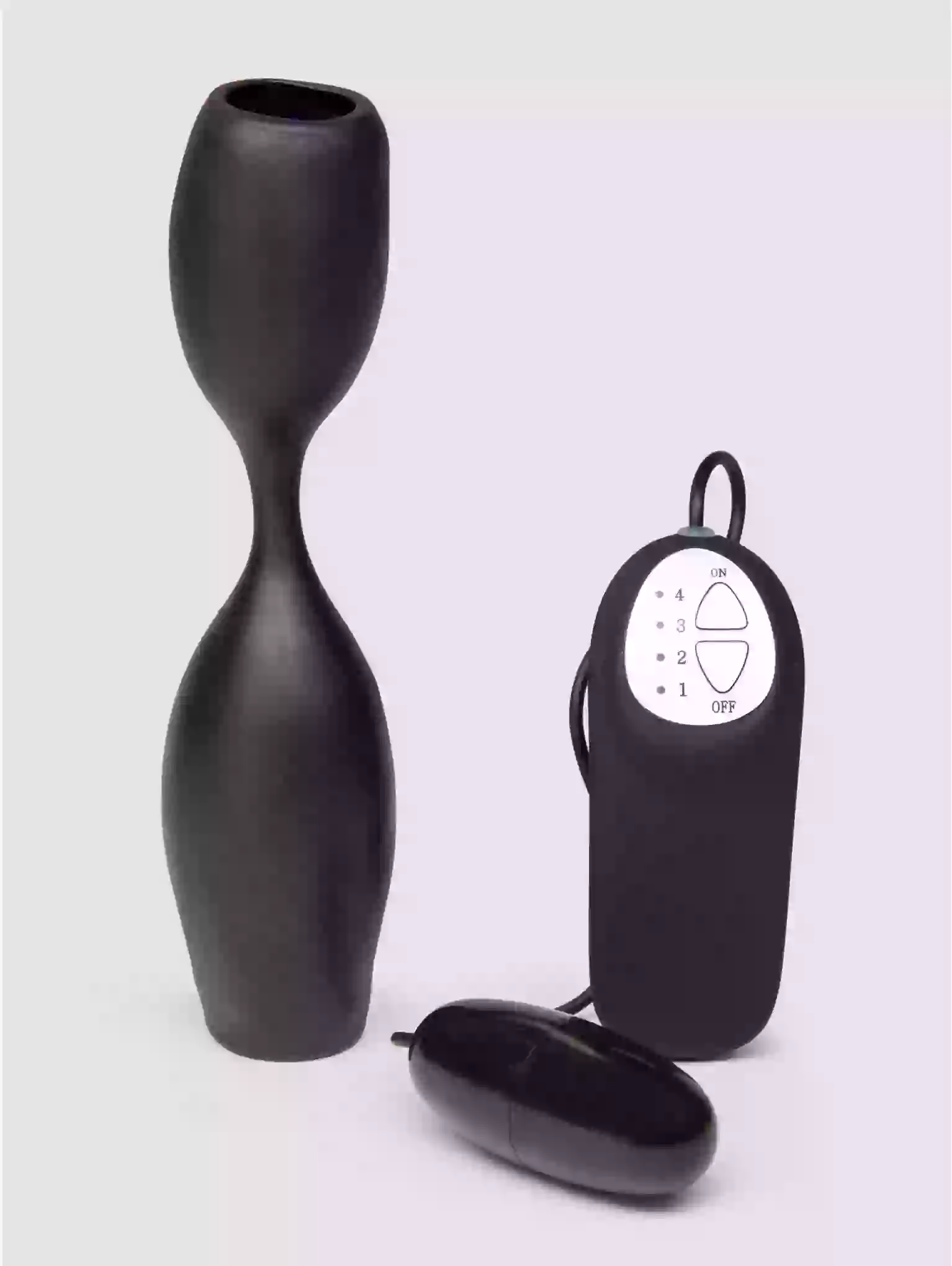 Black egg-shaped device with remote control on a white background