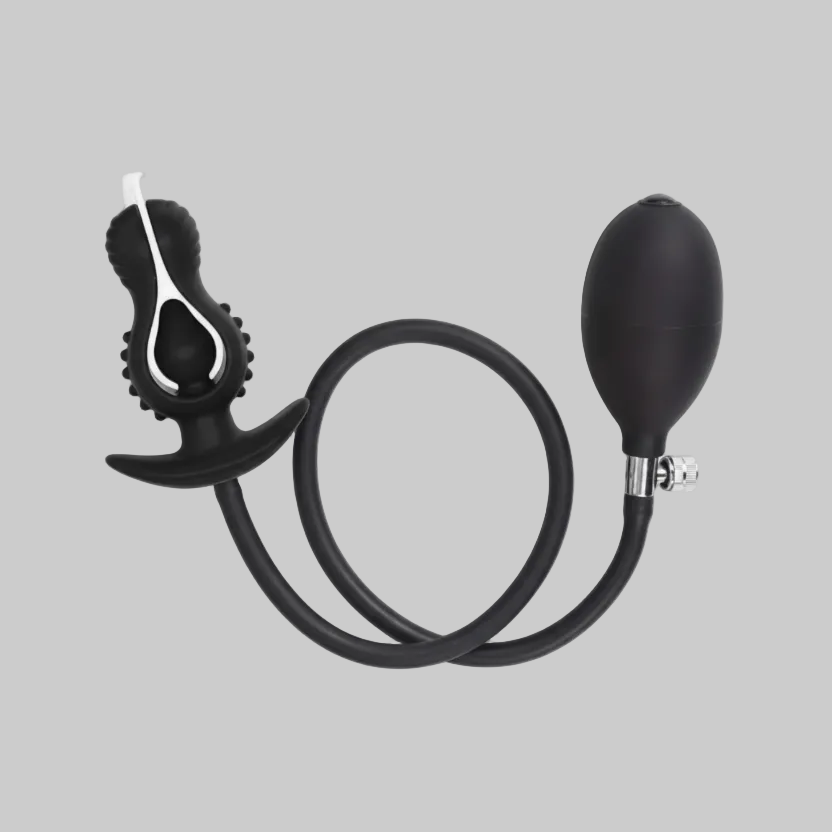 Black and silver blowgun on a gray background