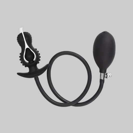 Black and silver blowgun on a gray background