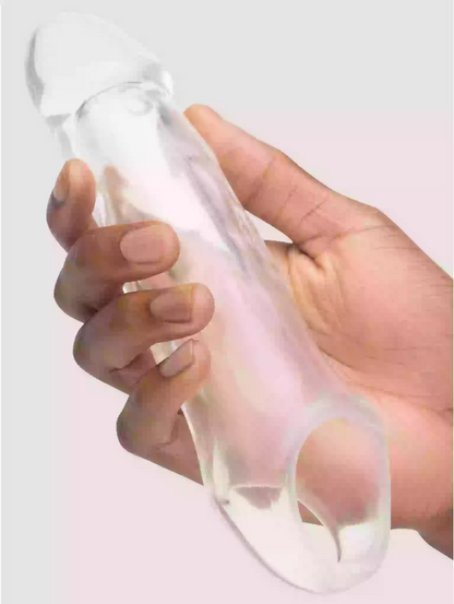 Hand holding a clear silicone sleeve over a light-colored background