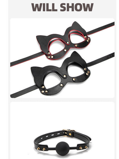 Black cat-eye mask with red accents and a black leather collar on a white background.