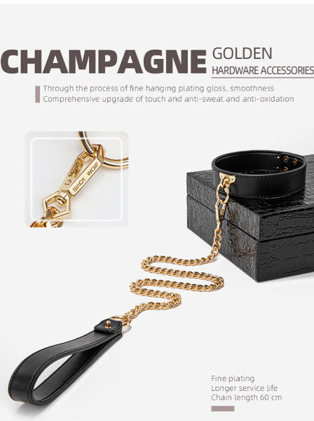 Black handbag with gold chain and keychain on a white background