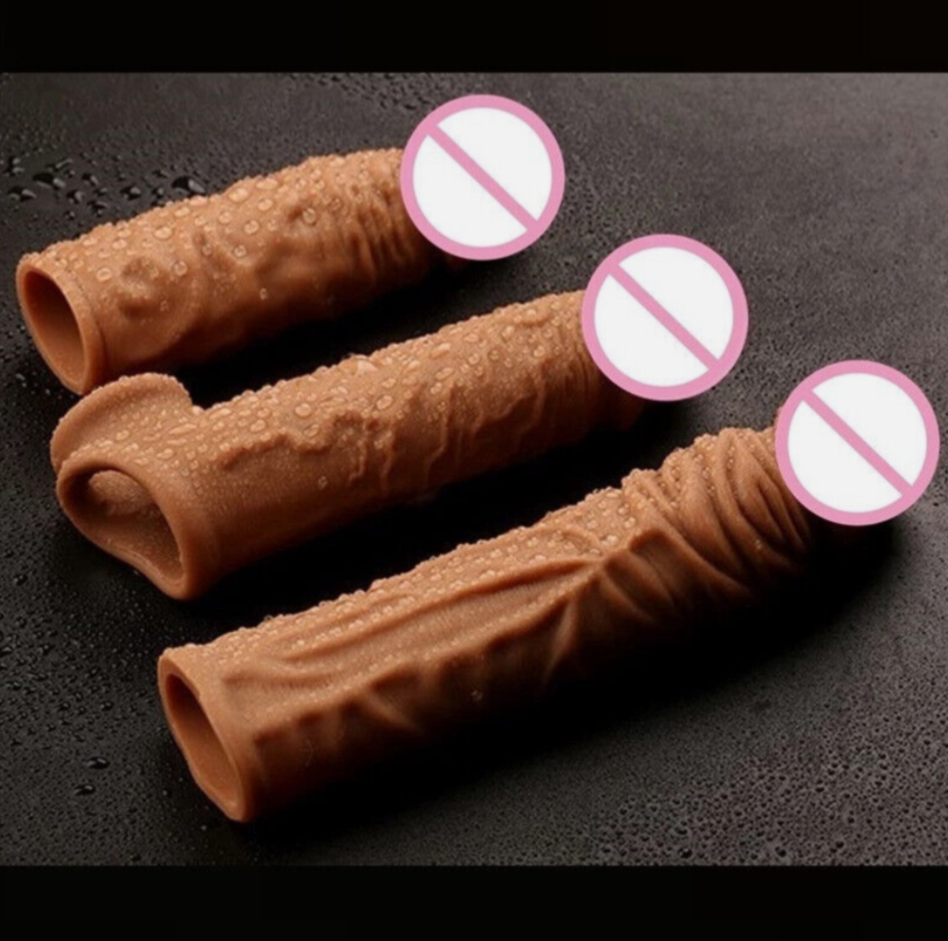 Three chocolate wafers on a black surface with pink 'no' signs over them.