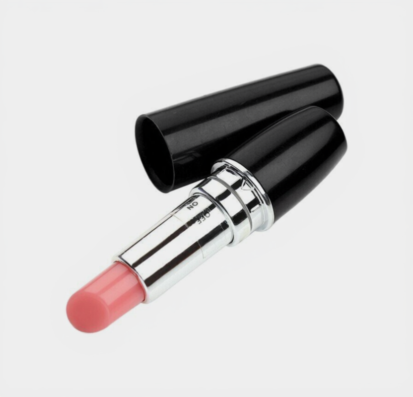 Pink lipstick with black case on a light gray background