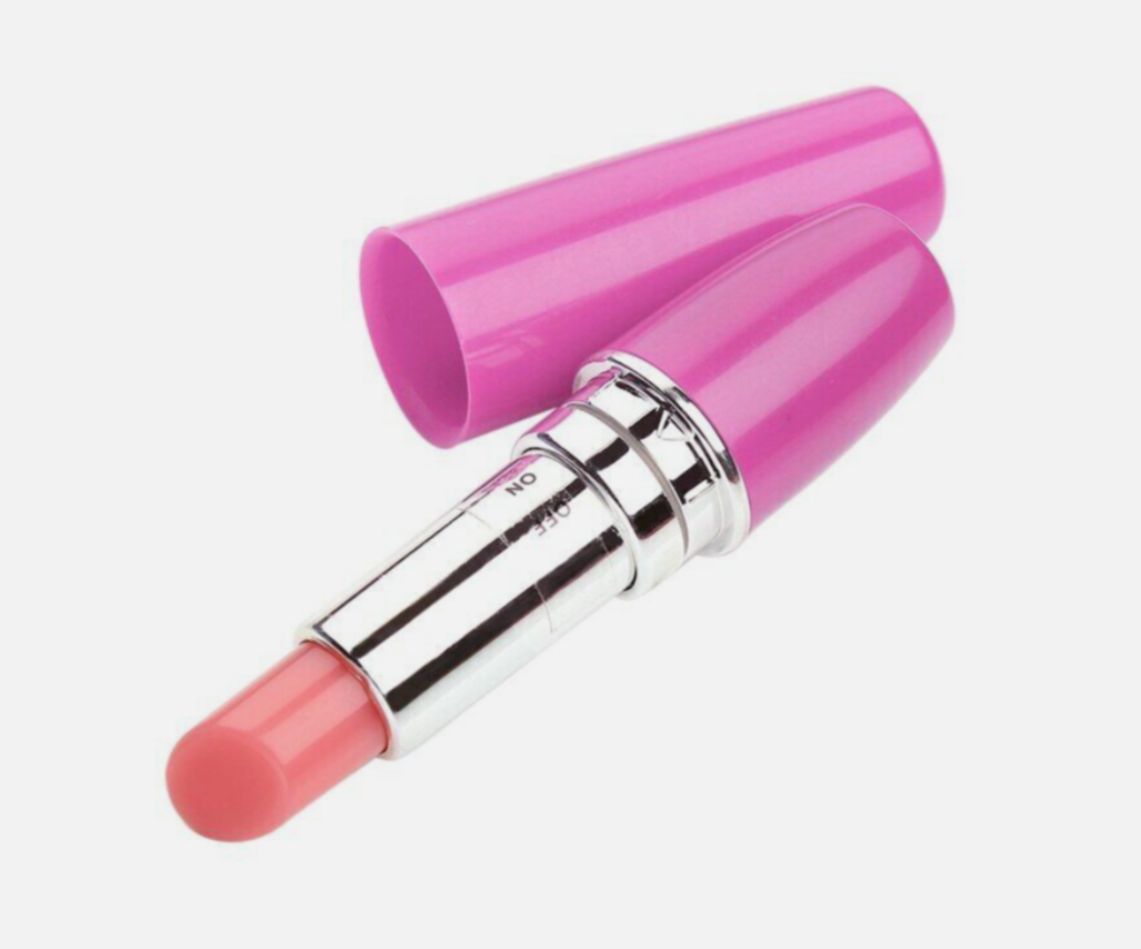 Pink lipstick with silver cap on a white background