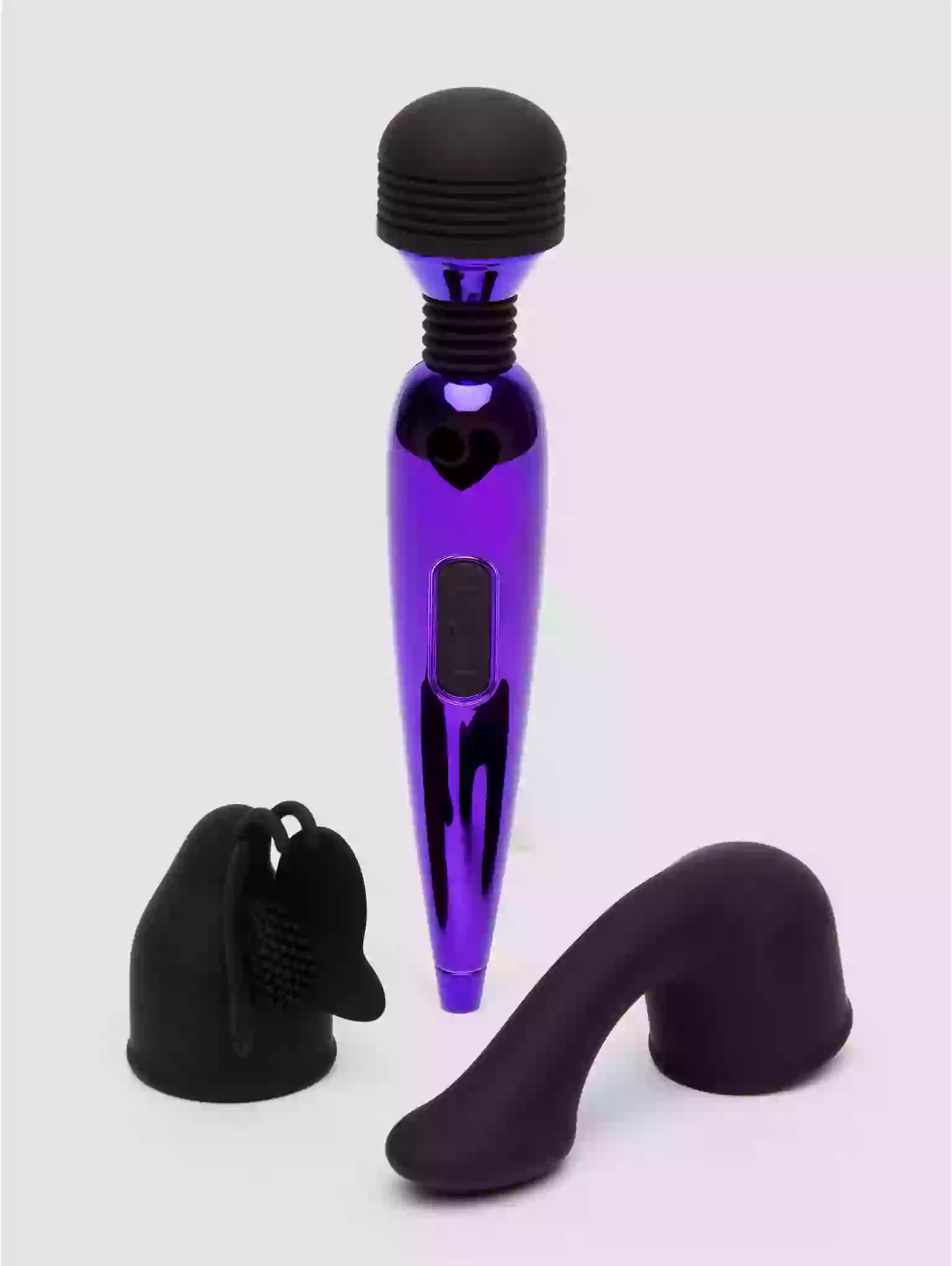 Purple and black massage tool on a light gray background