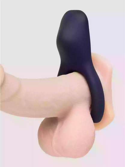 Black silicone product being held by a hand on a light gray background
