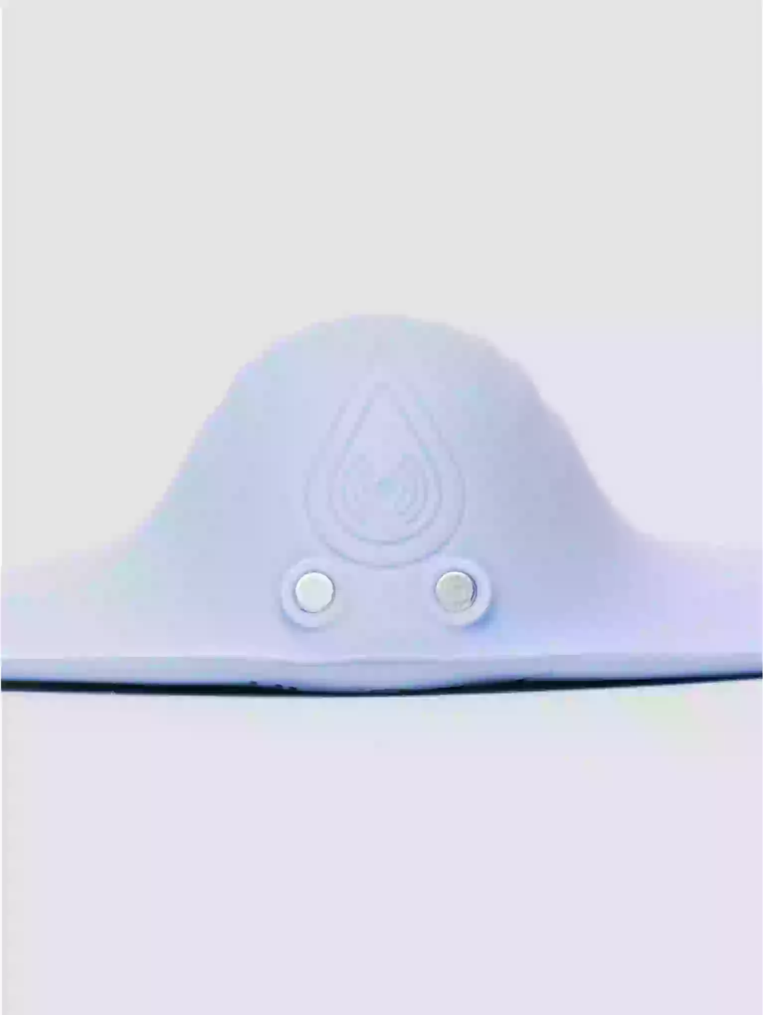 White electronic device with two buttons on a light gray background
