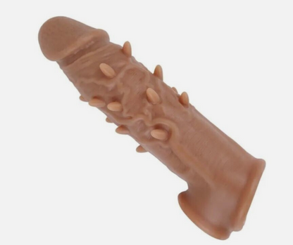 Brown dog toy with spikes on a white background