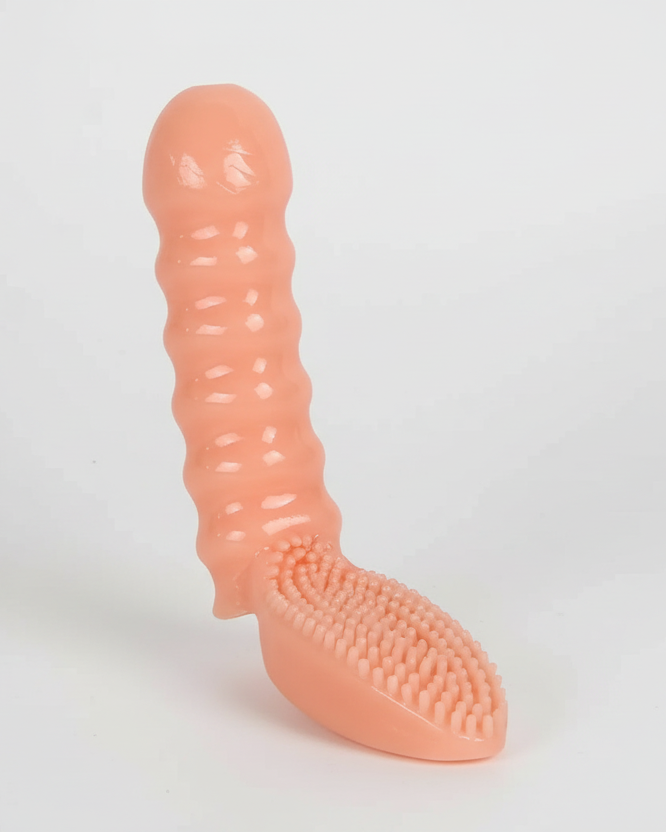 Pink silicone dog toy with textured surface on a light gray background