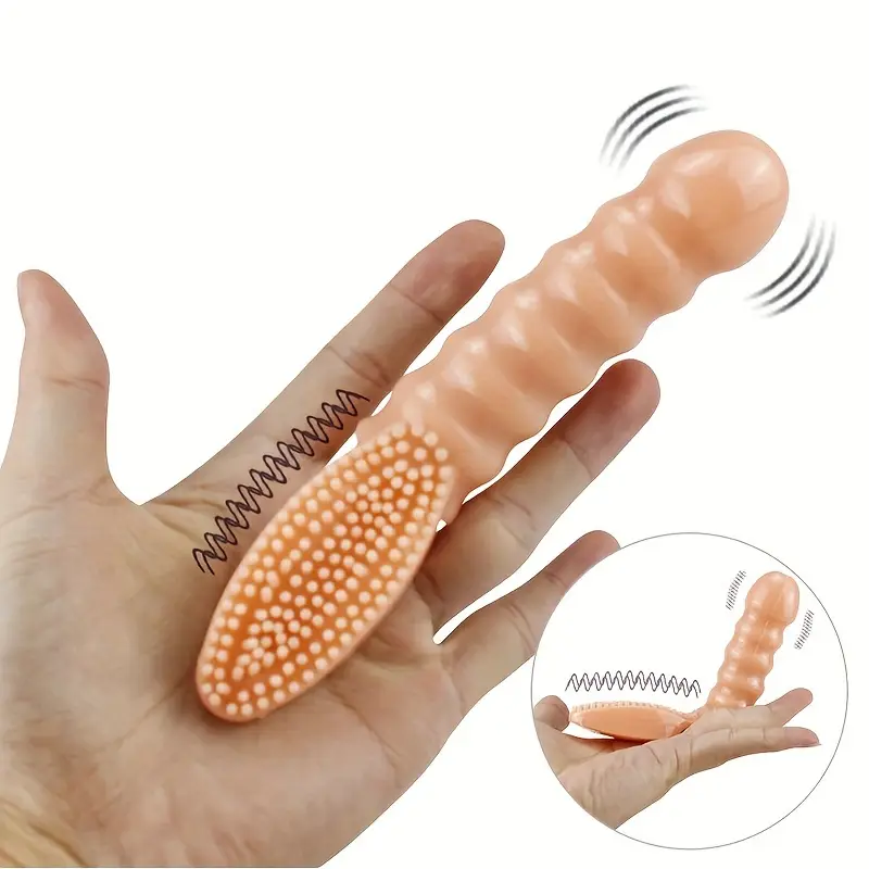 Hand holding a silicone finger massager with detailed design on a white background