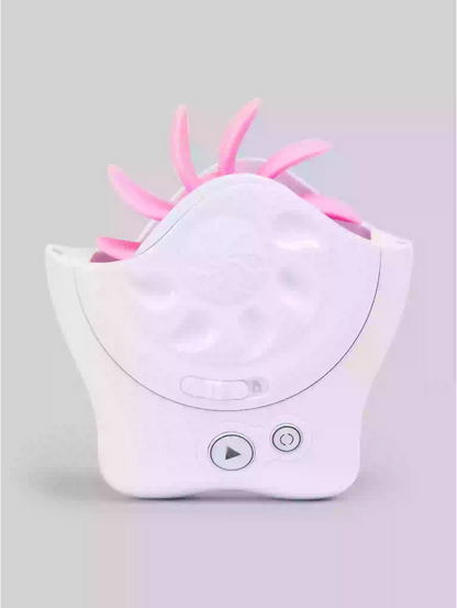 White electronic device with pink antenna-like feature on a gray background