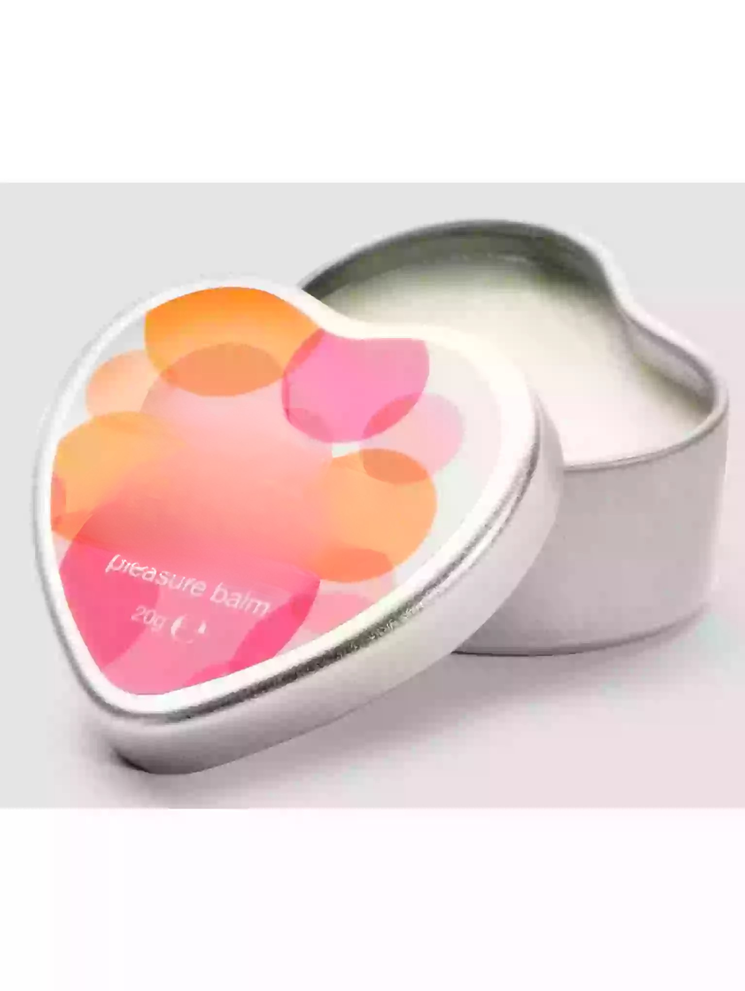 Heart-shaped balm tin with colorful design on a white background
