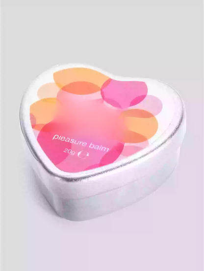 Heart-shaped container of 'pleasure balm' with colorful design on a light gray background
