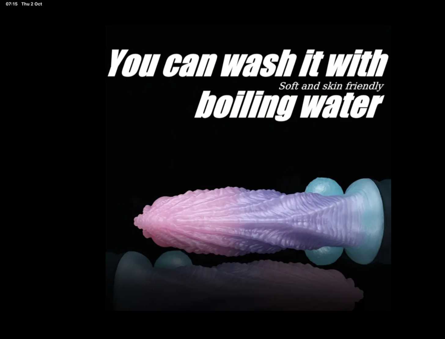 Purple and pink object with text about washing it with boiling water on a black background