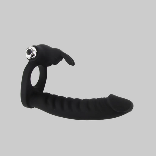 Black flexible tool with a metallic end on a gray background