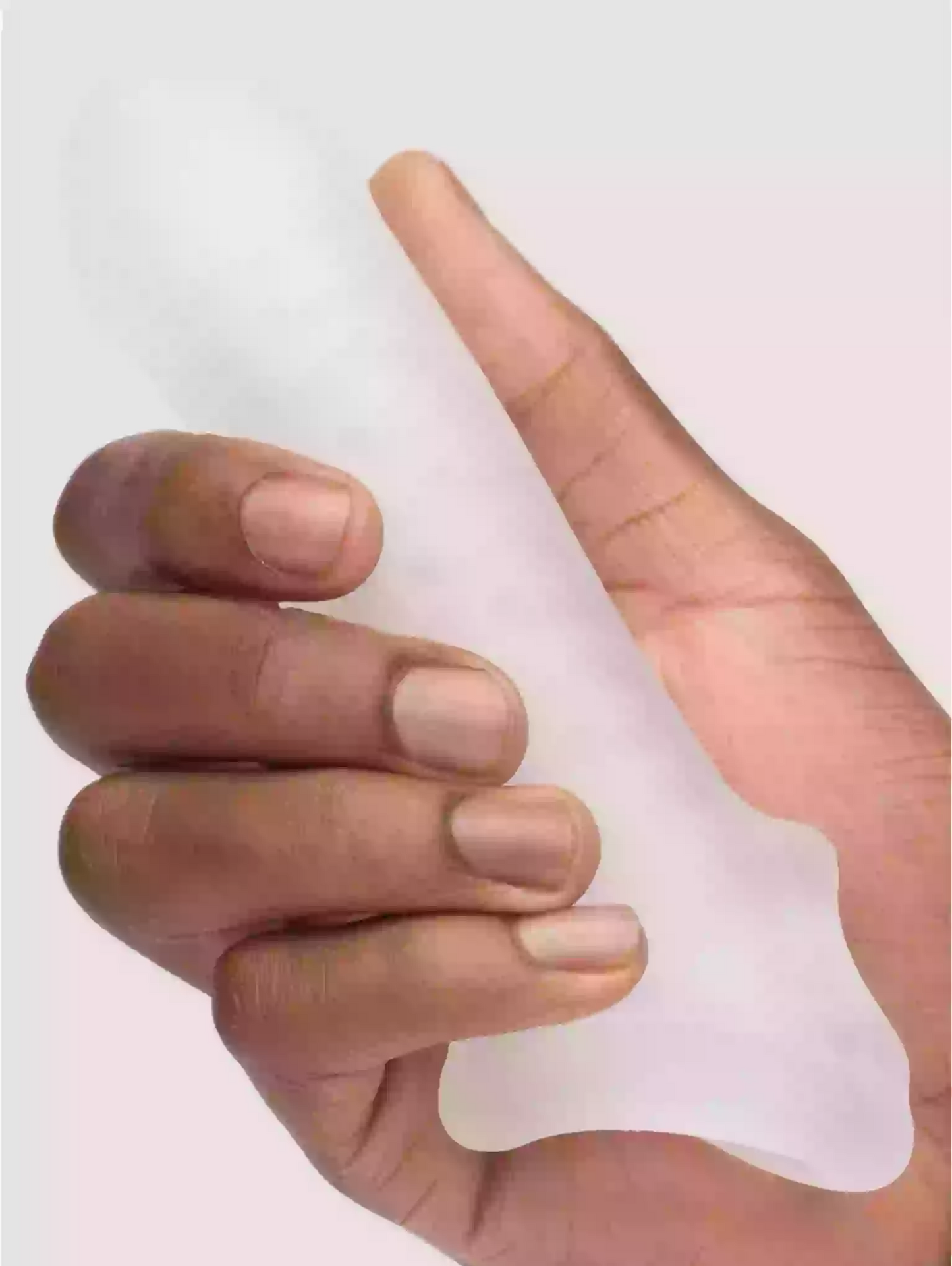 Hand holding a clear silicone sleeve against a white background