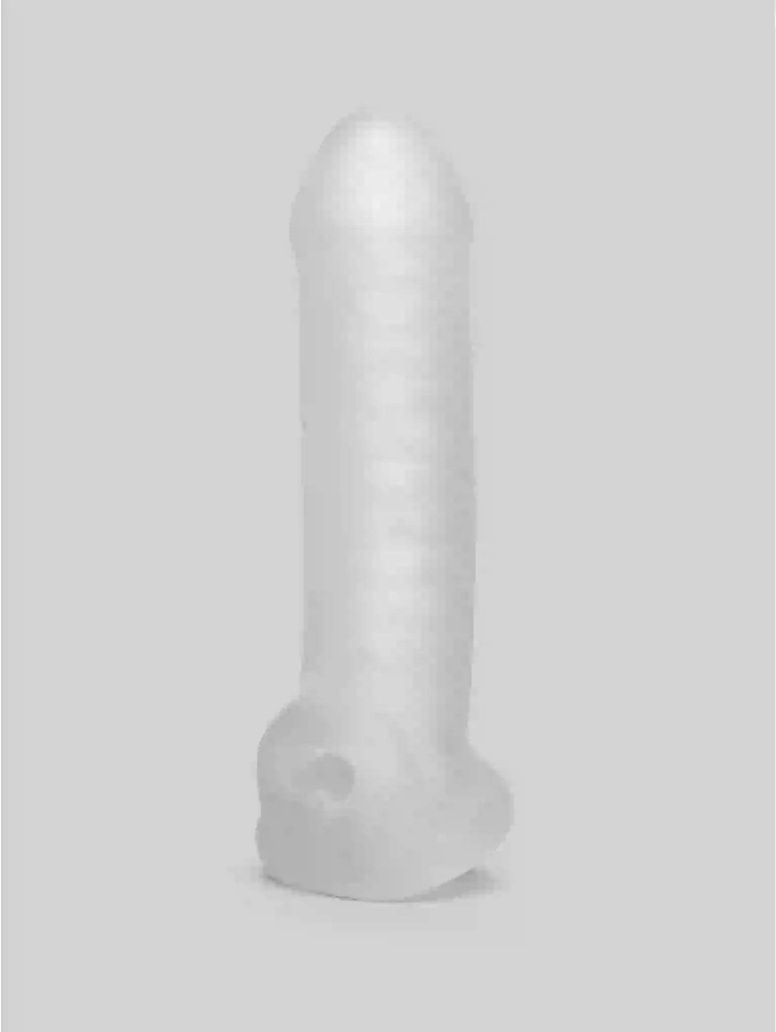 Clear silicone butt plug on a light gray background