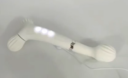 White plastic object with a handle on a light gray background