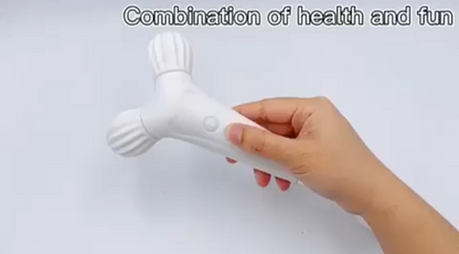 Hand holding a white handheld massage tool against a light gray background with text 'Combination of health and fun'.