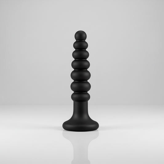 Black, cylindrical object with stacked spheres on a white background