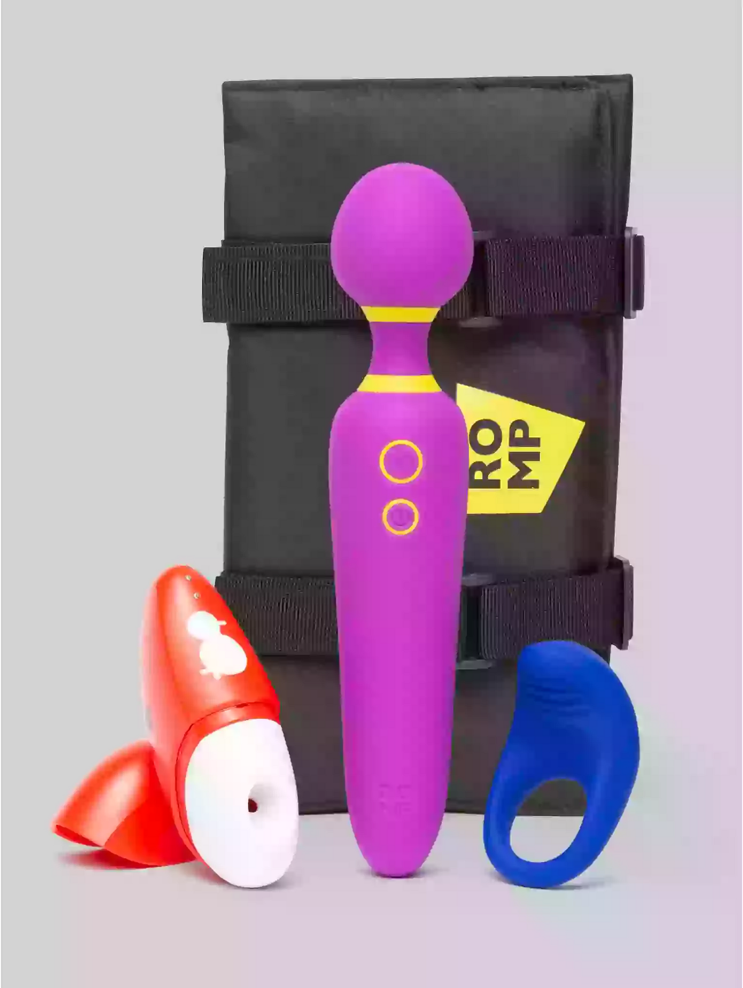 Purple and red massage tool with a black carrying case on a gradient background