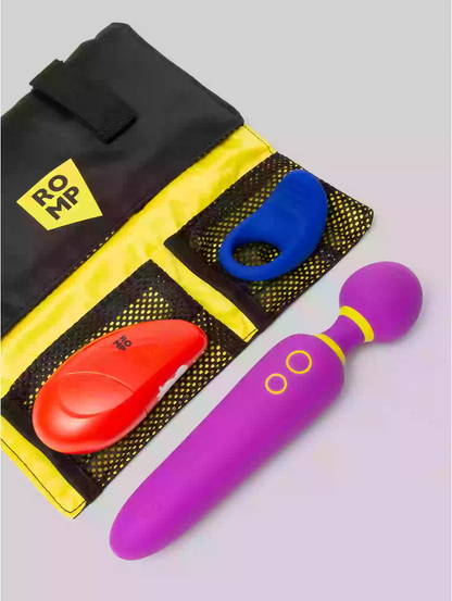 Purple toy with red and blue attachments on a black and yellow tool bag.
