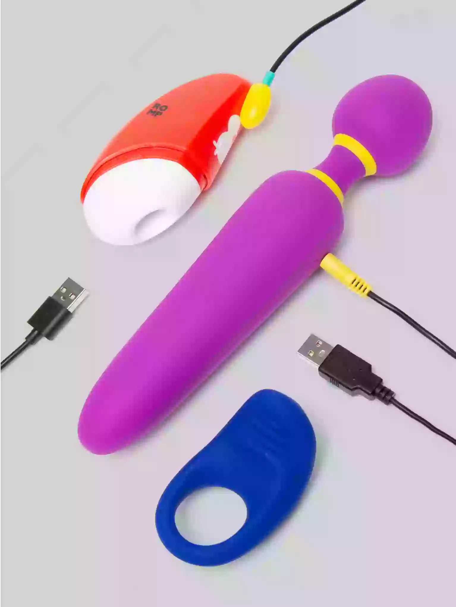 Purple and blue electronic devices with USB cables on a light gray background