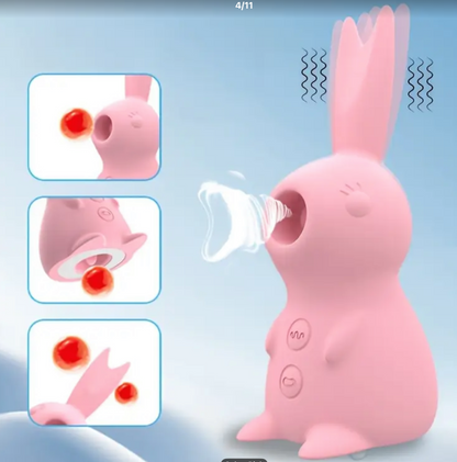 Pink rabbit-shaped device with a nozzle, likely for cleaning purposes, on a light blue background.