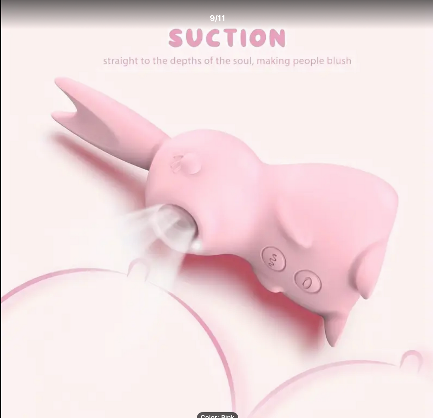 Pink shark-shaped suction device with text on a light pink background