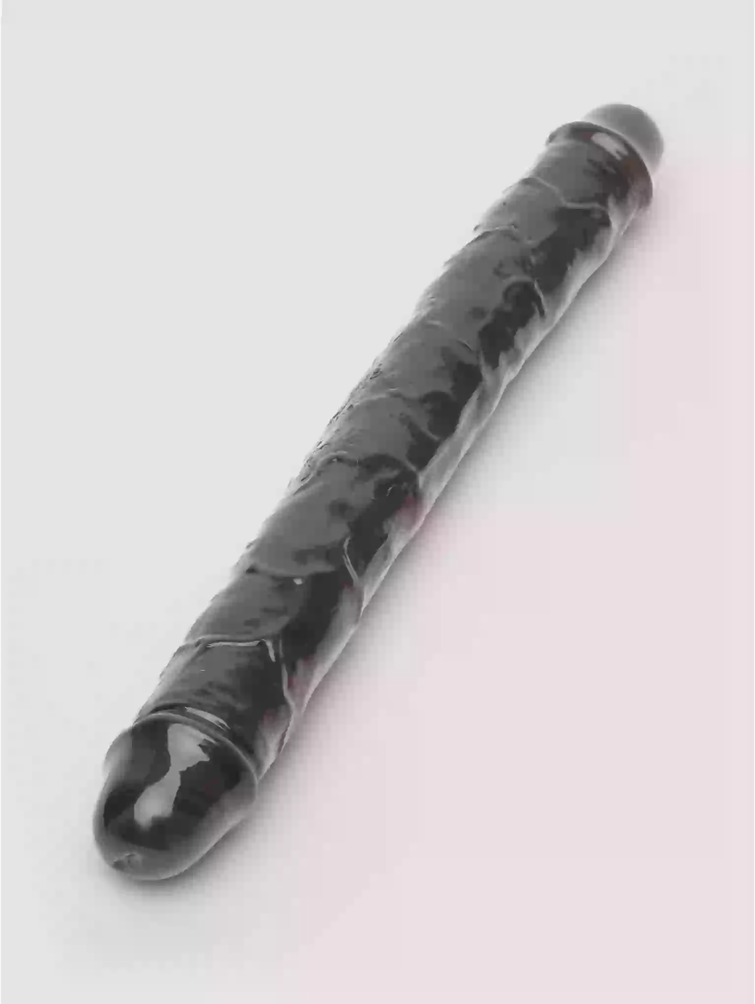 Black marble-textured pen on a light gray background