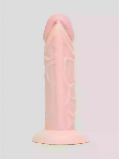 Pastel pink and orange silicone product on a light gray background