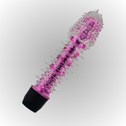Pink and clear cylindrical object with black base on a white background