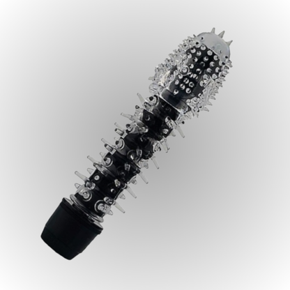 Black and clear spiked cylindrical object on a white background