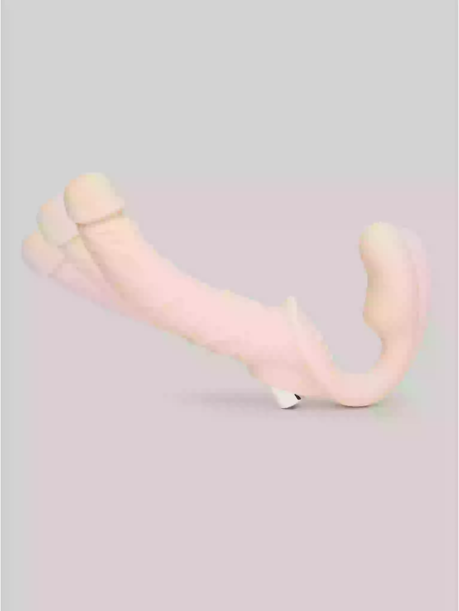 Pink and beige plush toy on a light gray background
