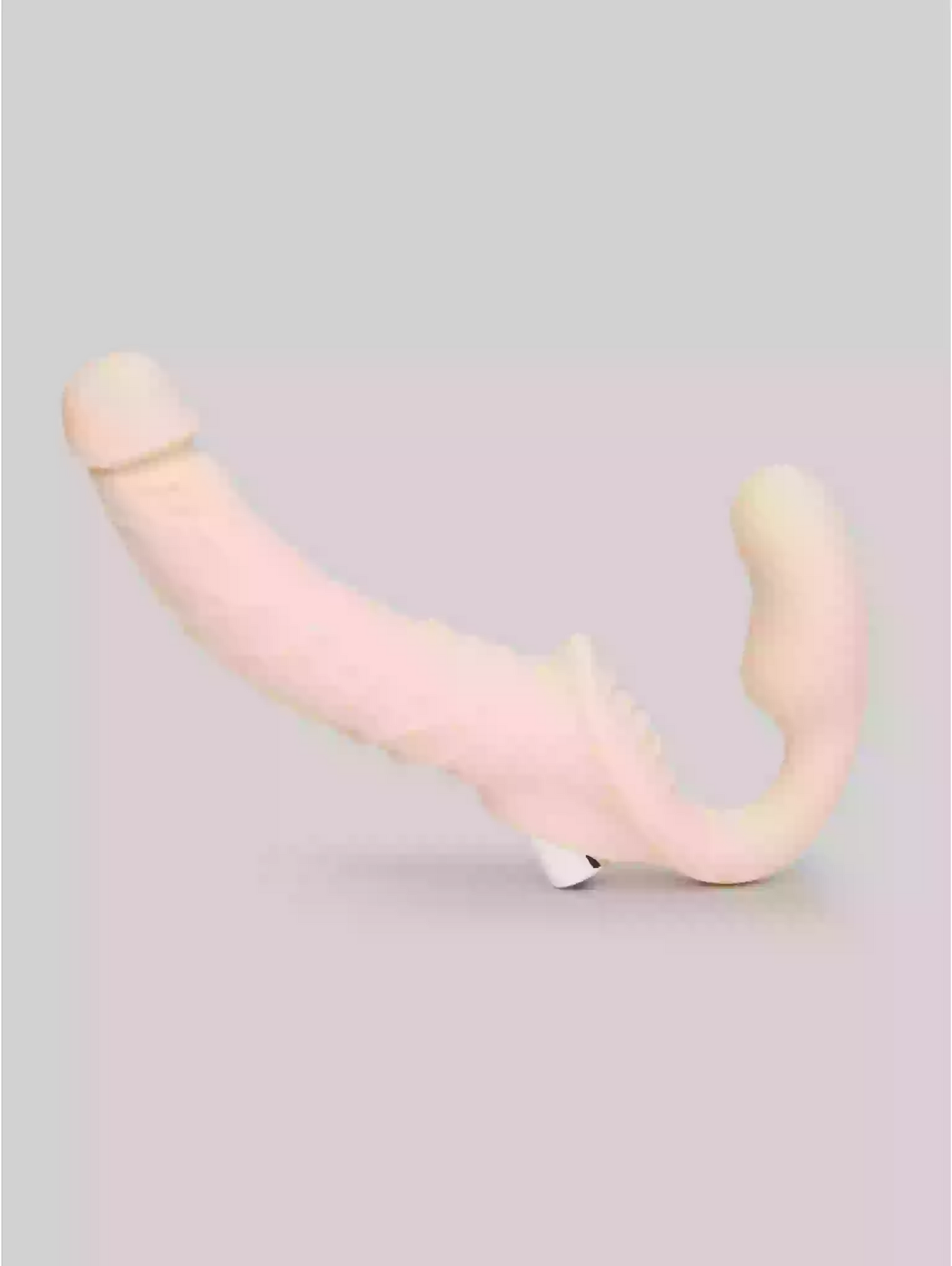 Pink and beige U-shaped object on a light gray background