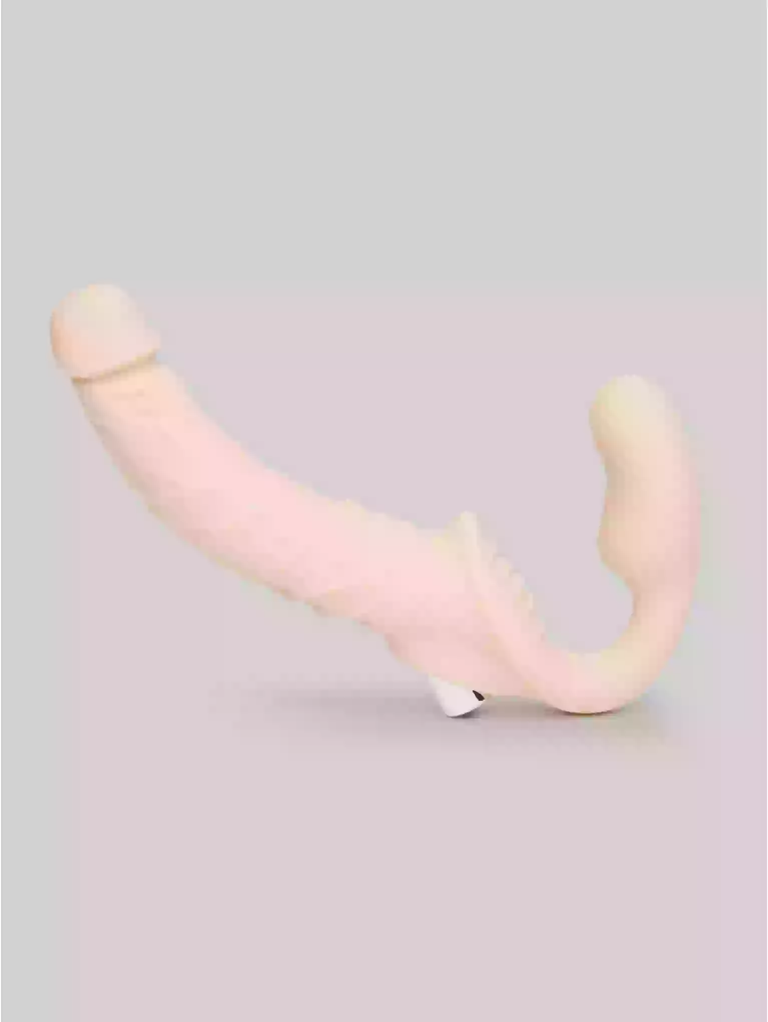 Pink and beige U-shaped object on a light gray background