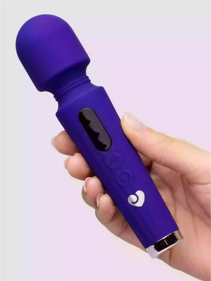 Purple handheld device held in a hand against a light purple background