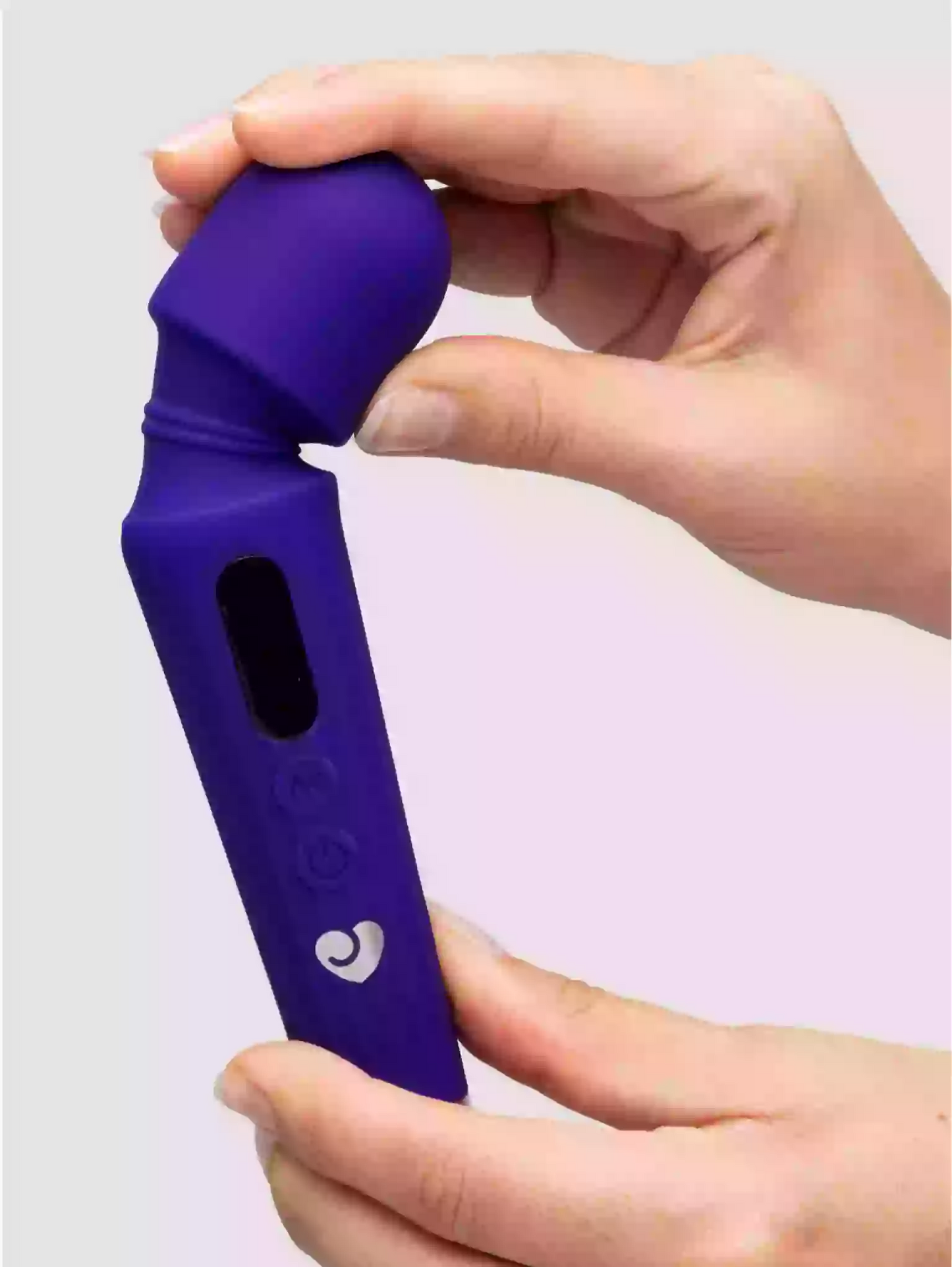 Purple handheld device with a brand logo held by a hand against a light gray background