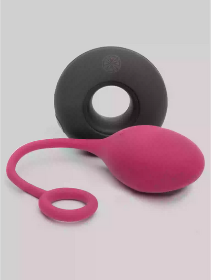 Pink and black silicone tool on a light gray background