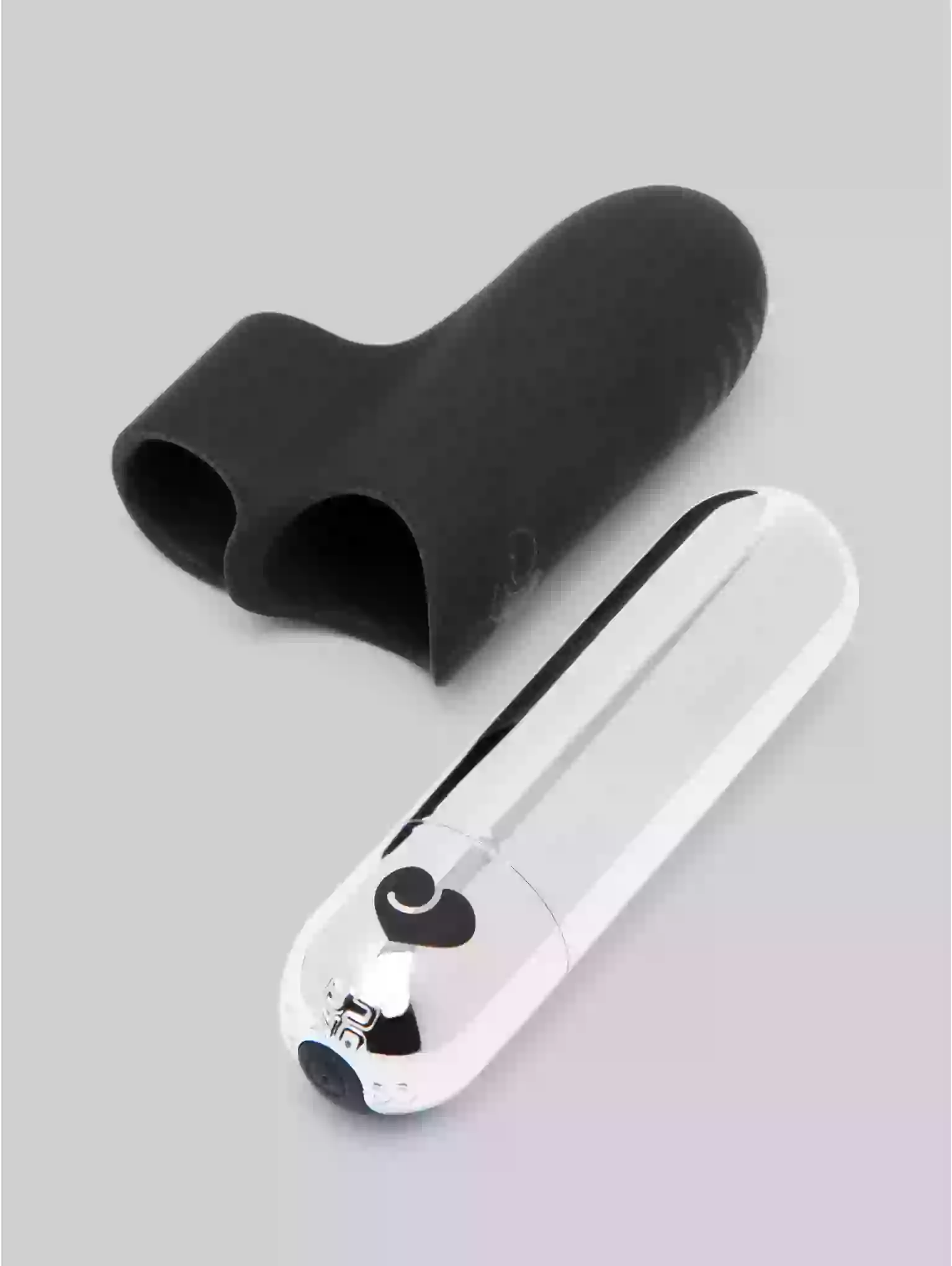 Black silicone product and white electronic device on a gray background