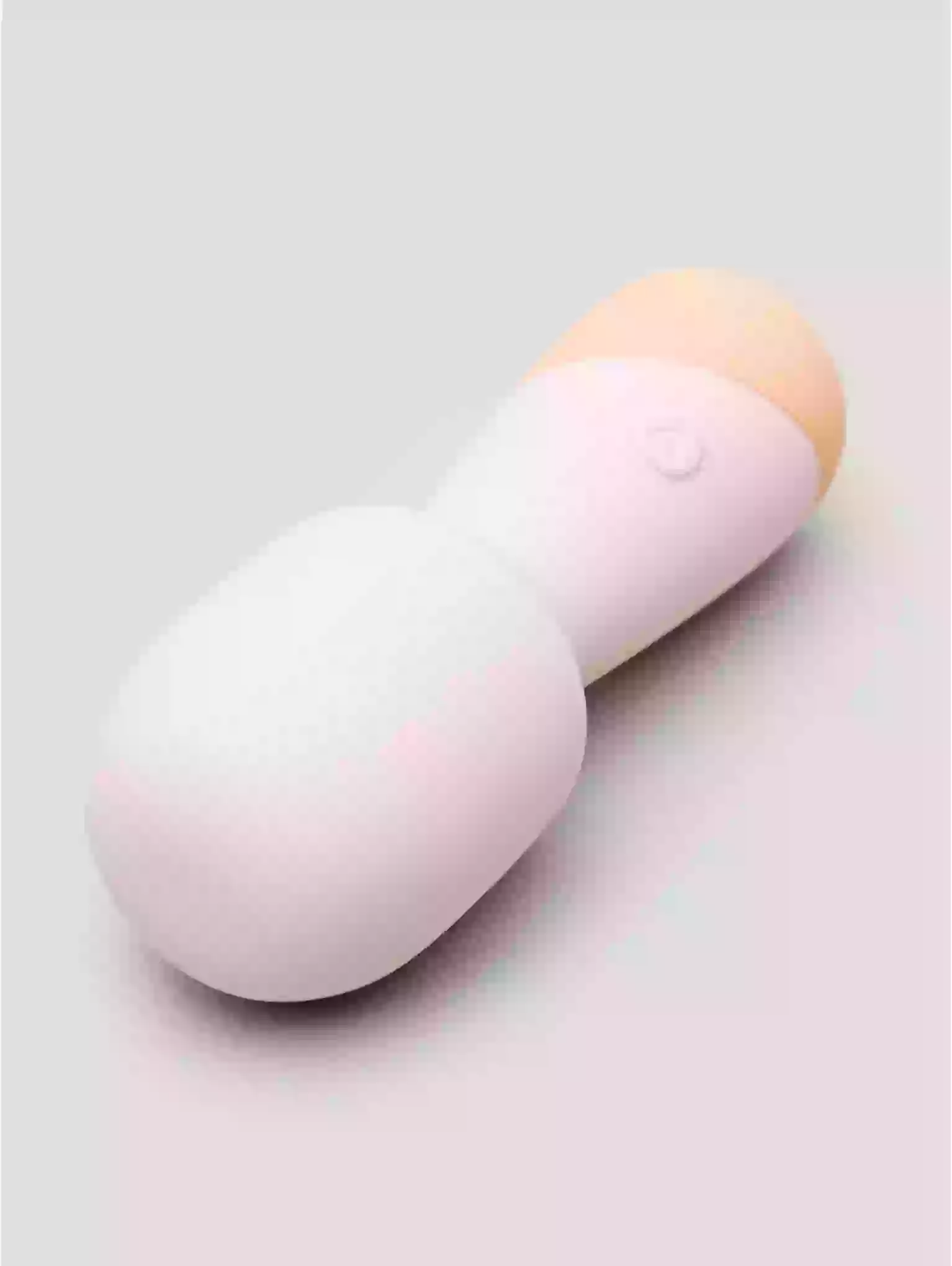 Two gradient-colored bottles on a light gray background
