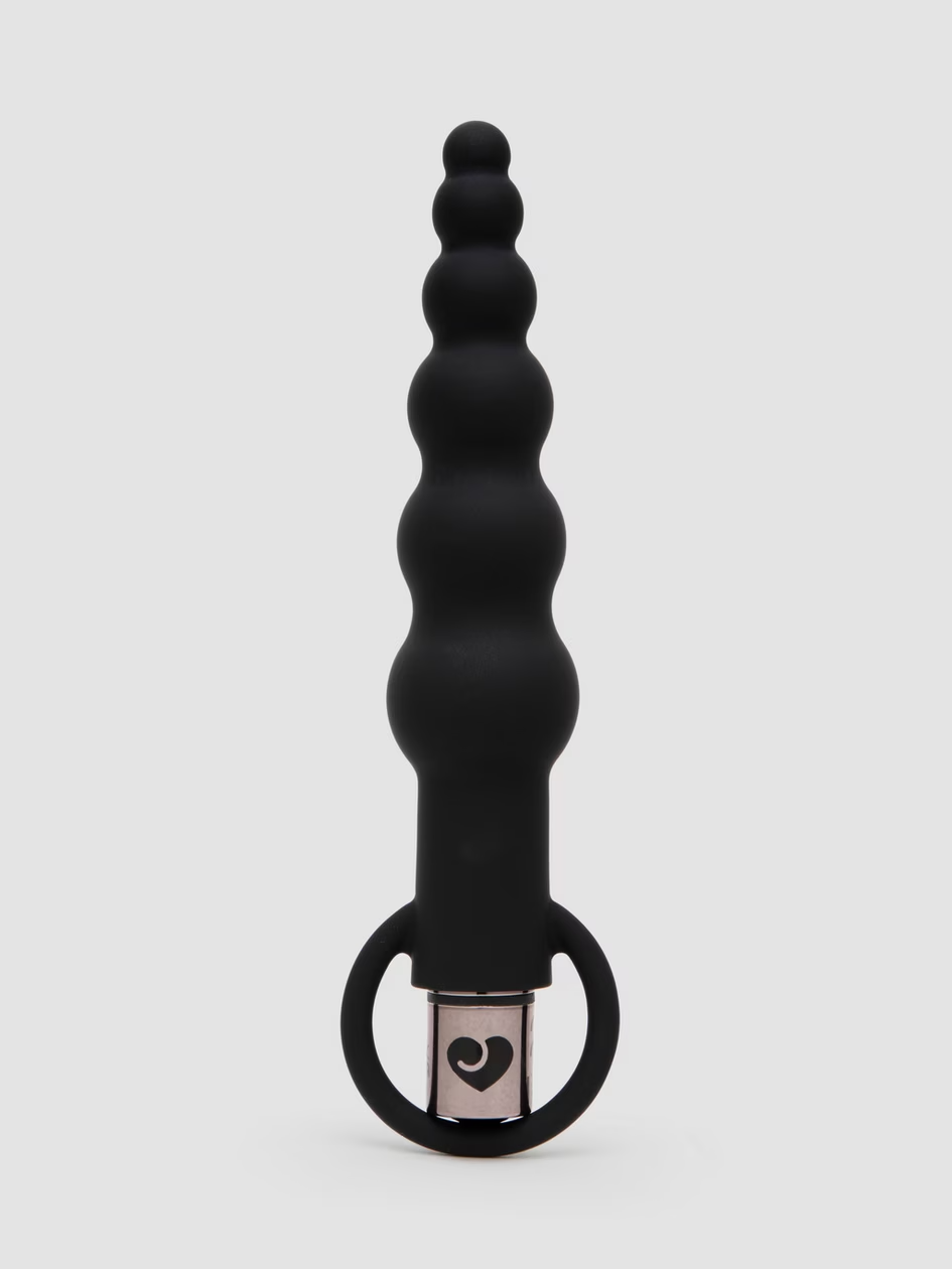 Black silicone butt plug with heart design on a white background
