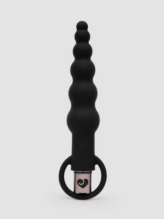 Black silicone butt plug with heart design on a white background